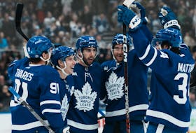 Maple Leafs' Mitchell Marner (second from left) celebrates with teammates after scoring against the Los Angeles Kings during the second period at Scotiabank Arena in Toronto on Thursday, Dec. 8, 2022.
