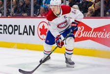Montreal Canadiens' Nick Suzuki in action against the Vancouver Canucks during the second period at Rogers Arena in Vancouver on Dec. 5, 2022.