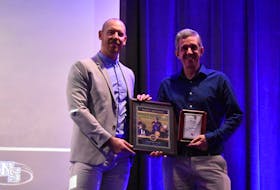 John Murray, right, receives the 2022 Baseball Nova Scotia Grassroots Coach of the Year from Cory Boutilier, the technical director of Baseball Nova Scotia. CONTRIBUTED