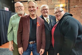 From left: Dave Stewart, Stuart Hickox, George Clark-Dunning and Troy Perrot-Sanderson stand for a photo after a screening of "Positive: When HIV/AIDS hit P.E.I." Hickox, Clark-Dunning and Perrot-Sanderson were all subjects in the documentary, which was made by Stewart. - Logan MacLean • The Guardian