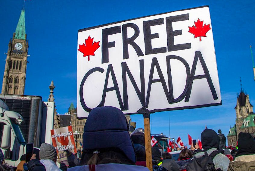  Freedom Convoy protesters gather around Parliament Hill on Sunday.