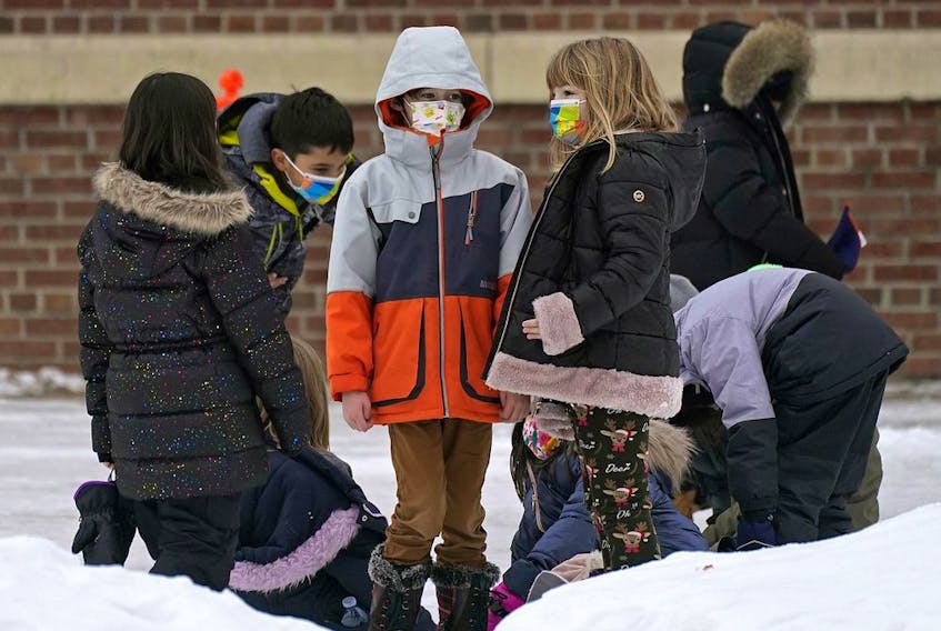  Children in the schoolyard outside Garneau School in Edmonton on Thursday, January 20, 2022.