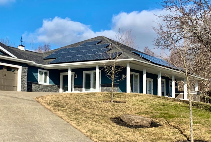 Nova Scotia Power backed down from its plan to charge new solar power users $8 per month per kilowatt hours of installed capacity. Above, this Sydney-area house has a number of solar panels on its southeast and southwest facing roofs. DAVID JALA/CAPE BRETON POST
