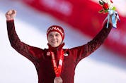 Bronze medalist James Crawford of Team Canada poses during the Men's Alpine Combined medal ceremony on day six of the Beijing 2022 Winter Olympic Games.