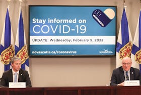 Nova Scotia Premier Tim Houston, left, and chief medical officer of health Dr. Robert Strang at a COVID-19 briefing on Wednesday, Feb. 9, 2022.