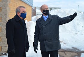 Coun. Terry Bernard, right, chair of Charlottetown council’s parks and recreation committee, talks to Mayor Philip Brown on Feb. 10 about the 80 additional parking spaces that will be part of the new Simmons Sport Centre.