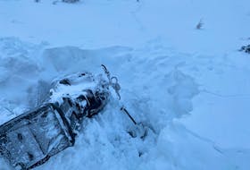 Kent O’Grady's snowmobile stuck in the Blow Me Down Mountains on Feb. 6.
