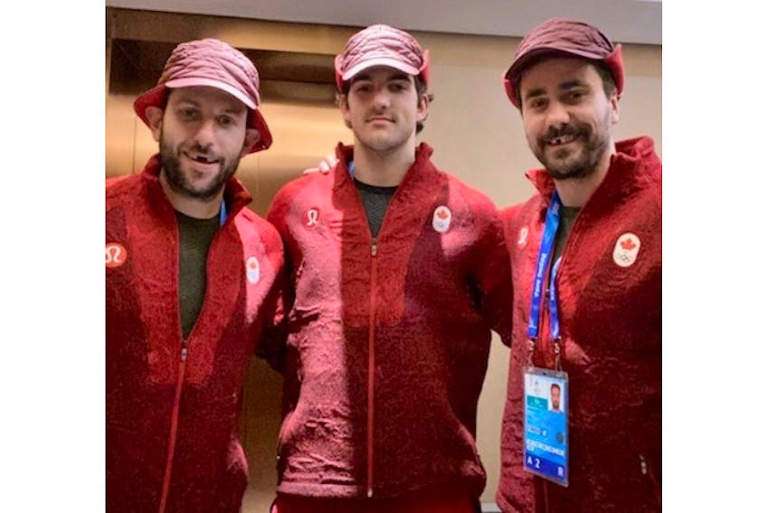 Morgan Ellis, right, poses with Canadian men’s hockey teammates Jason Demers, left, and Jack McBain at the 2022 Winter Olympics in Beijing. Ellis, a defenceman and one of six reserves named to Team Canada’s roster, is from East Bideford, P.E.I.