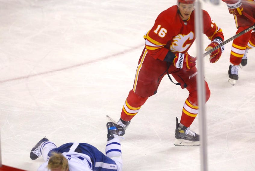 Calgary Flames Nikita Zadorov decks Toronto Maple Leafs Ondrej Kase in first period NHL action at the Scotiabank Saddledome in Calgary on Thursday, Feb. 10, 2022.