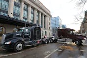  Two big rigs block a downtown Ottawa street again on Thursday.