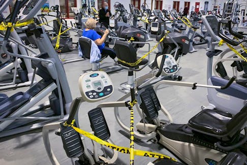 People take part in an early-morning workout at a Montreal gym in October 2020, a few days before Quebec ordered many of the province's gyms to close.