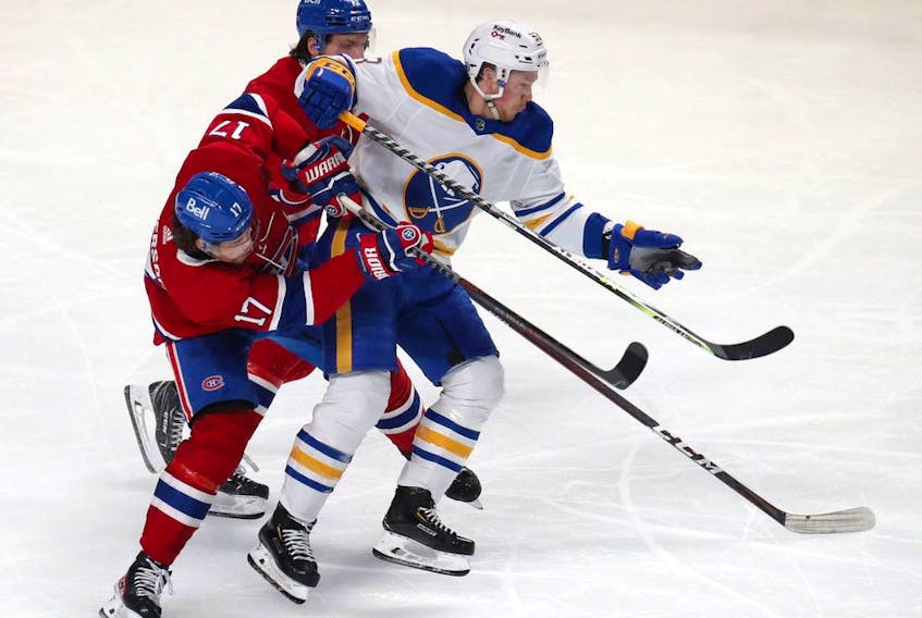 Buffalo Sabres' Jeff Skinner (53) and Canadiens' Josh Anderson (17) collide during the third period at the Bell Centre on Sunday, Feb. 13, 2022, in Montreal. Skinner had a five-point outing against the Canadiens with four goals and an assist. 