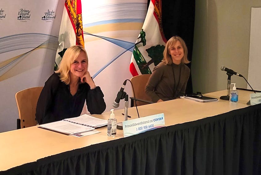 Chief public health officer Dr. Heather Morrison, left, and provincial epidemiologist Dr. Marguerite Cameron speak at a COVID-19 media briefing Feb. 8, 2022. 