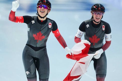 Ivanie Blondin and Valerie Maltais of Team Canada celebrate after winning the Gold medal in a new Olympic record time of 2:53.44 during the Women's Team Pursuit Final A.