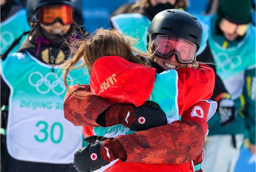  Canada’s Laurie Blouin runs out to congratulate Japan’s Reira Iwabuchi in the women’s snowboard big air final at the Beijing 2022 Winter Olympics on Tuesday, February 15, 2022. Gavin Young/Postmedia