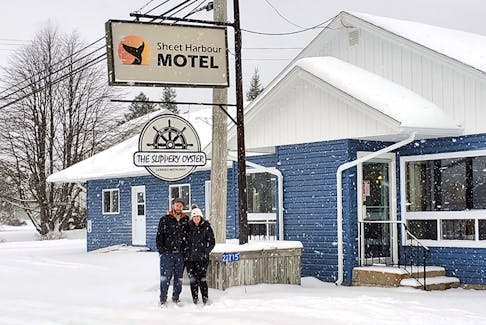 David Josey and Lisa Burns, co-owners of the Sheet Harbour Motel and the Slippery Oyster restaurant, outside their businesses on Monday. Benjamin Russell
