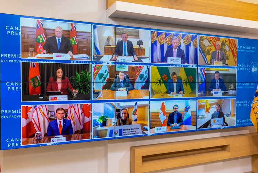 Provincial and territorial premiers are shown on screens during a First Ministers’ meeting on Feb. 4. Prime Minister Justin Trudeau spoke with the same leaders on Feb. 14 to inform them of his plans to invoke the Emergencies Act.
