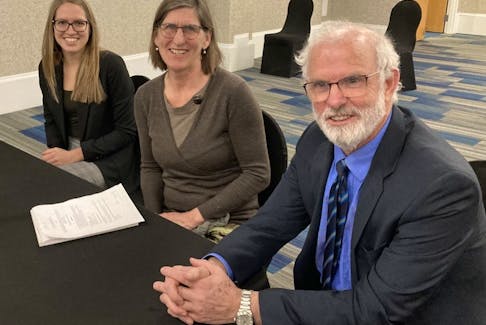 /Lawyer Vince Calderhead, accompanied by law student Elizabeth Dreise and Disability Rights coalition lawyer Claire McNeil, middle, sits in a Halifax conference room for a human rights commission board of inquiry hearing on Thursday, Feb. 16, 2022.