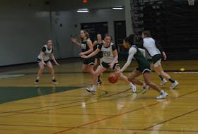 The UPEI Panthers' Lauren Rainford drives to the basket as Grace Lancaster defends at practice on Feb. 15. The Panthers resume regular-season action in the Atlantic University Sport Women's Basketball Conference on Feb. 18 against the UNB Reds. The tip-off at the Chi-Wan Young Sports Centre is 6 p.m.
