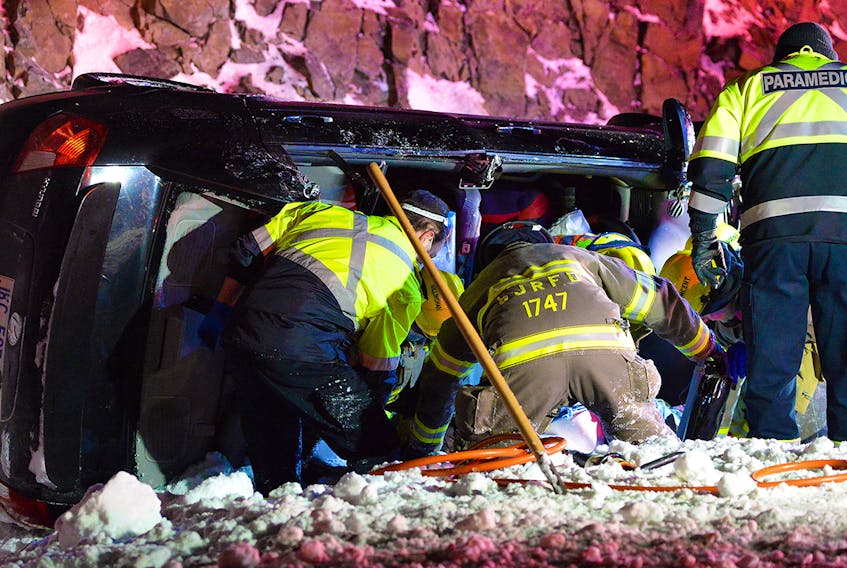 Two males were sent to hospital with serious injuries after the car they were in overturned on Peacekeepers Way early Thursday morning. Keith Gosse/The Telegram