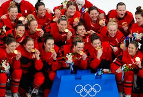Canada players pose with their gold medals after beating the United States 3-2 in a game on Thursday at the Beijing Olympics. Stellarton’s Blayre Turnbull is second, from right in the first row. Halifax’s Jill Saulnier is in the second row, first on the left.  REUTERS/David W Cerny