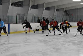 Members of the Pictou County Scotians junior B team doing a skating, warm-up drill during a recent practice at the Trenton Minor Sports Community Centre.