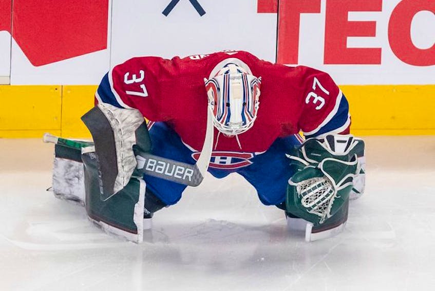 Montreal Canadiens goaltender Andrew Hammond (37) stretches prior to Habs' game against the St. Louis Blues in Montreal on Thursday, Feb. 17, 2022.