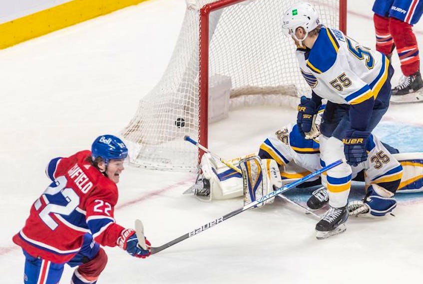 Montreal Canadiens right wing Cole Caufield (22) scores the tying goal against the St. Louis Blues in the dying seconds of the third period in Montreal on Thursday, February 17, 2022.