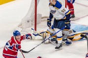 Montreal Canadiens right wing Cole Caufield (22) celebrates after scoring the tying goal against the St. Louis Blues in the dying seconds of the third period in Montreal on Thursday, Feb. 17, 2022. 