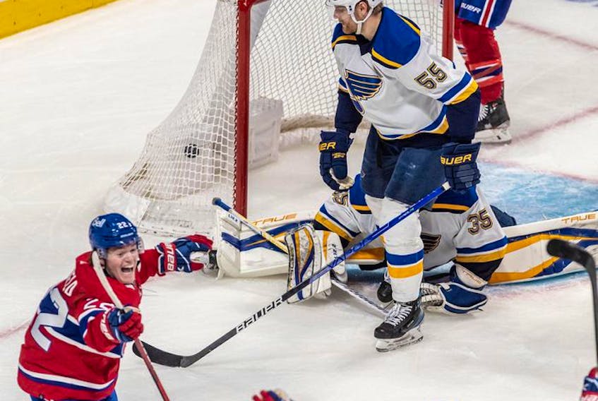 Montreal Canadiens right wing Cole Caufield (22) celebrates after scoring the tying goal against the St. Louis Blues in the dying seconds of the third period in Montreal on Thursday, Feb. 17, 2022. 