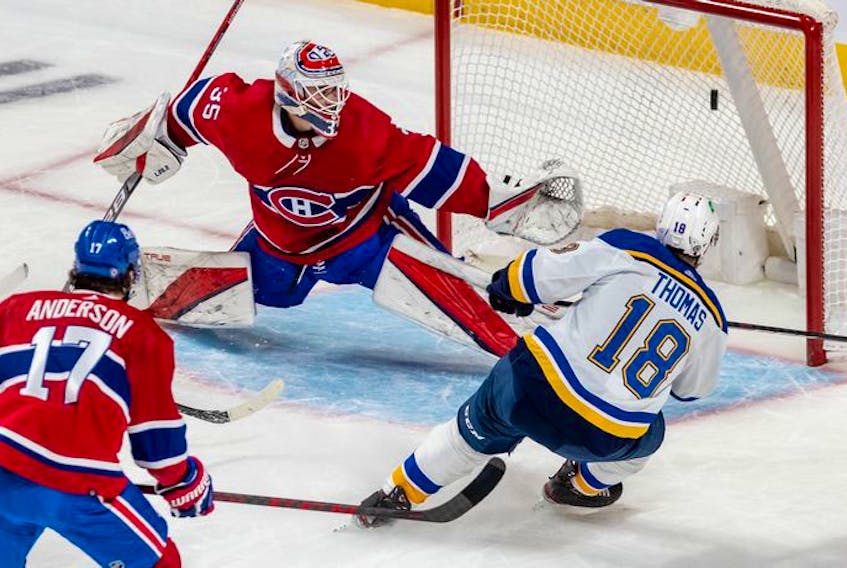St. Louis Blues centre Robert Thomas (18) scores against Montreal Canadiens goaltender Sam Montembeault (35) during first period against the St. Louis Blues in Montreal on Thursday, Feb. 17, 2022. 