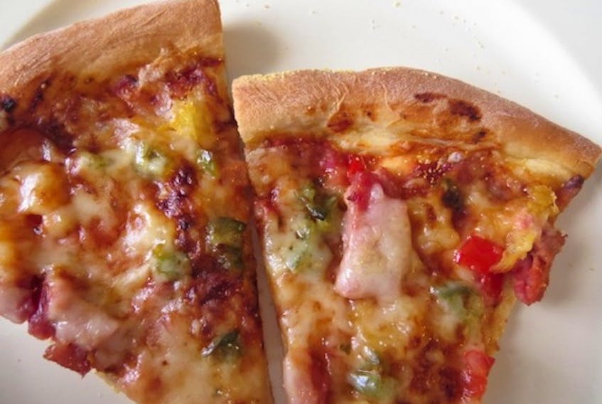 This pizza is made using the pizza dough recipe in this week’s column from Margaret Prouse. Toppings are tomato sauce, ham, pineapple, chopped red and green peppers and mozzarella cheese.
