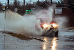A Jeep plows through a big puddle on St. Margaret's Bay Rd. near Bayers Lake on Friday, Feb. 18, 2022.
Ryan Taplin - The Chronicle Herald