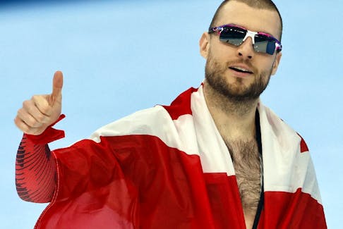Laurent Dubreuil of Canada reacts after winning silver.