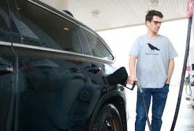 Christopher, who declined to provide his last name, fills his tank at an Irving on Riverside Drive on February 17. P.E.I.’s government will introduce legislation outlining its plans for implementing an increased price on carbon starting this spring.
