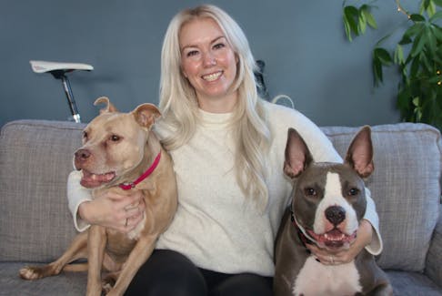 Michelle Henderson’s family includes rescue dogs Ruby and Eugene. Her friendly dogs have helped many people change their opinion of pit bulls. LYNN CURWIN 