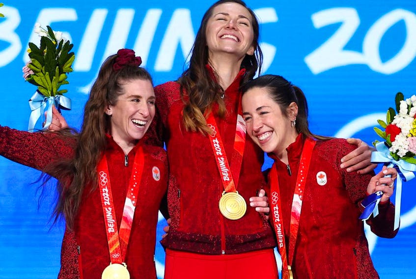  Gold medallists Ivanie Blondin, Valerie Maltais and Isabelle Weidemann of Team Canada pose with their medals during the Women’s Team Pursuit medal ceremony on Day 11 of the Beijing 2022 Winter Olympic Games at Beijing Medal Plaza.
