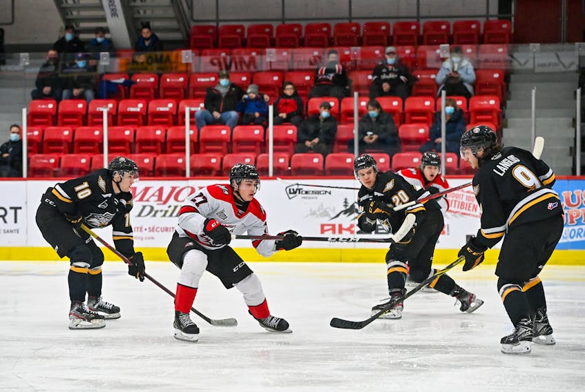 A trio of Cape Breton Eagles swarm around a lone Rouyn-Noranda Huskies player during QMJHL action in northwestern Québec on Friday. The Eagles lost 6-2 to the Huskies on Friday before falling to the Val d’Or Foreurs by the same score on Saturday. From left, Eagles players Charles Savoie, Romain Rodzinski and Jérémy Langlois surround Huskies forward Jérémie Minville during Friday’s contest in Rouyn-Noranda. JEAN LAPOINTE PHOTO