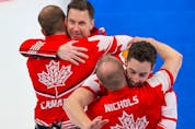  Team Canada celebrates after defeating the USA to win the bronze medal in men’s curling at the Beijing 2022 Winter Olympics on Friday, February 18, 2022.