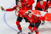 Team Canada celebrates with their gold medals after downing the USA 3-2 in women’s hockey at the Beijing 2022 Winter Olympics.