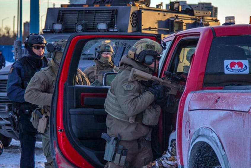  Police from multiple forces moved in to clear out the remaining “Freedom Convoy” protesters that were set up in a parking lot on Coventry Road, Sunday, February 20, 2022.