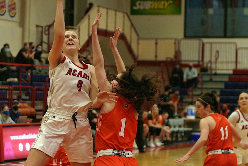 Acadia Axewomen wing Jayda Veinot looks to hit a shot after drawing contact during Atlantic University Sport basketball action Feb. 20 in Wolfville.