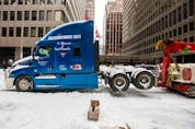  A truck is towed from Kent Street, as Canadian police worked to evict the last of the trucks and supporters occupying the downtown core, three weeks after a protest against coronavirus disease (COVID-19) vaccine mandates began in Ottawa, Ontario, Canada, February 20, 2022.