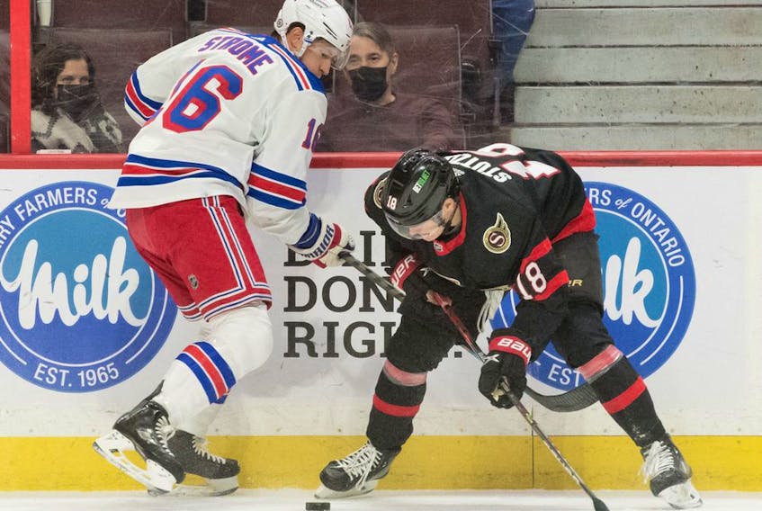 New York Rangers centre Ryan Strome (16) battles with Ottawa Senators left wing Tim Stuetzle (18) in the first period at the Canadian Tire Centre, Sunday, Feb. 20, 2022.