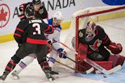  New York Rangers centr Kevin Rooney (17) shoots on Ottawa Senators goalie Filip Gustavsson (32) in the third period at the Canadian Tire Centre, Feb. 20, 2022.