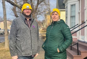 Adam Dolliver of SHYFT and Trish McCourt of the Tri-County Women's Centre says homelessness and the risk of homelessness is a very serious issue facing communities. The two are wearing yellow toques that people will be wear when the participate in the Coldest Night of the Year fundraiser, which is aimed at helping organizations that help others. TINA COMEAU PHOTO