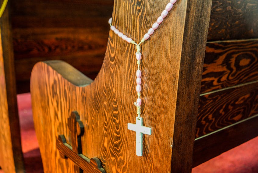 A rosary hangs from a pew at the Holy Ghost Ukrainian Catholic Church in Sydney on Thursday morning. JESSICA SMITH/CAPE BRETON POST