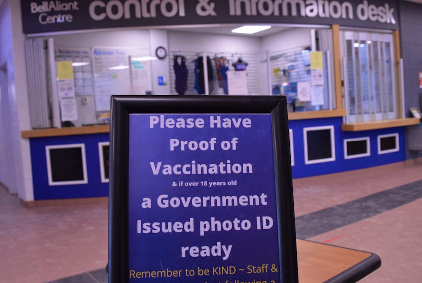These signs at the Bell Aliant Centre will not be needed after Feb. 28 when the Vax Pass system is ends. 