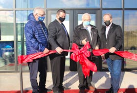 Summerside Coun. Brian McFeely, Matthew MacKay, minister of economic growth, Summerside Mayor Basil Stewart and Egmont MP Bobby Morrissey cut the ribbon at the opening of Summerside's new multi-purpose sports dome.