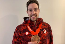 Charlottetown’s Brett Gallant, who throws second stones for the Brad Gushue curling team, displays his bronze medal from the 2022 Beijing Olympic Games.

